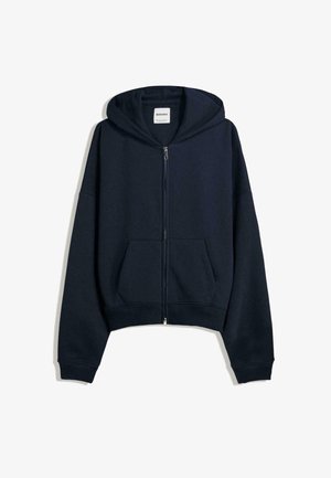 Marineblauwe cropped hoodie van zachte stof. Heeft een voorrits, grote voorzakken en een capuchon met trekkoord. Eenvoudig ontwerp.